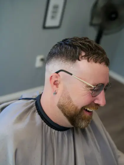 A mid fade with a beard trim, cut by Leandro Herrera