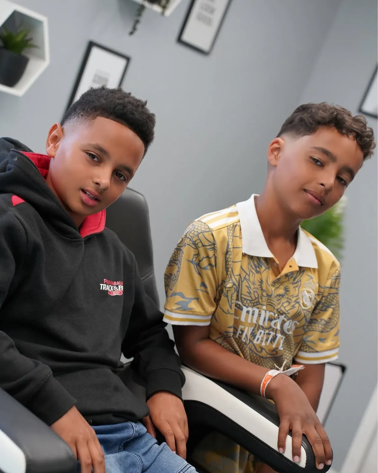 Two brothers in the shop, both freshly cut, cut by Leandro Herrera